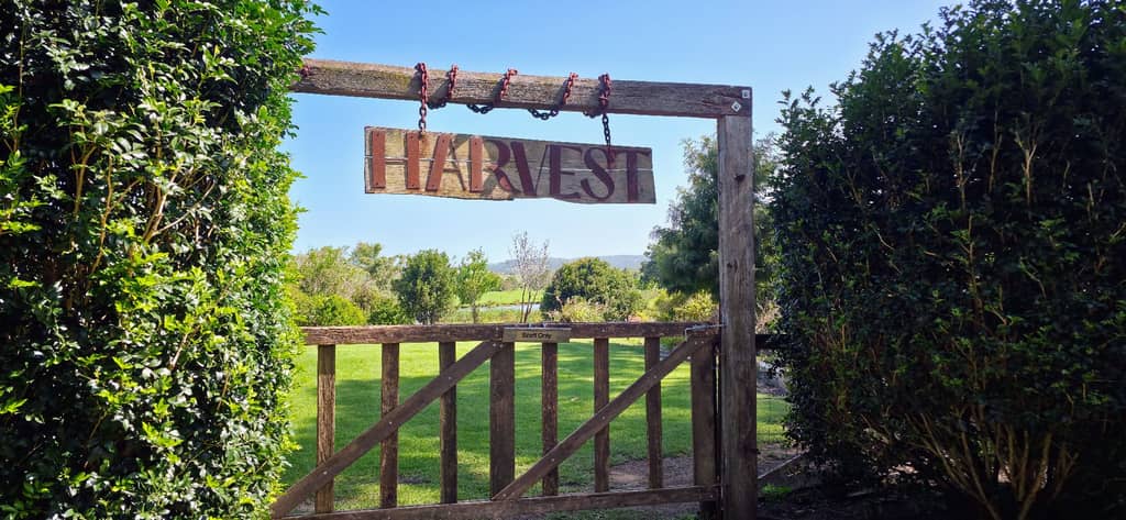 Harvest Milton farm gate with sunset behind