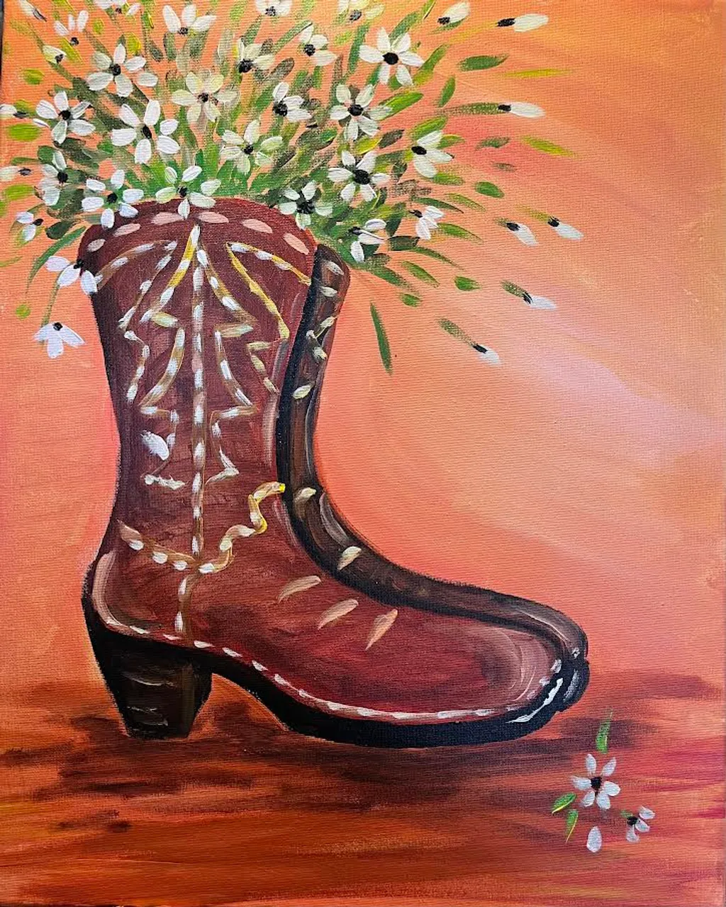 Painted cowgirl boot filled with white daisies on an orange background